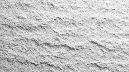 Close up of a textured white surface with horizontal ridges and variations.