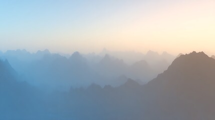 Obraz premium Misty mountains and soft sunset hues