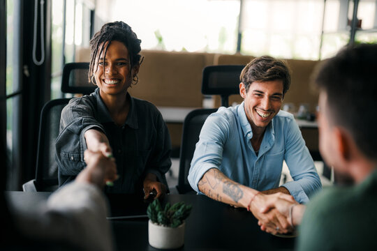 Success group of multiethnic entrepreneurs and business people achieving goals in corporate office