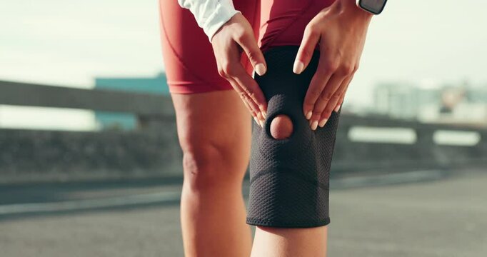 Fitness, knee pain and person with brace in city for exercise, marathon training and workout outdoors. Sports, runner and legs of athlete with injury support for wellness, accident or health in town