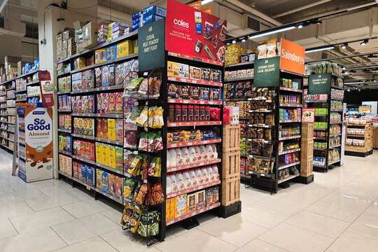 Penang, Malaysia &ndash; May 25, 2025: A well-organized supermarket aisle showcasing international food brands including Coles, Sainsbury&rsquo;s, and So Good in Jaya Grocer Store.