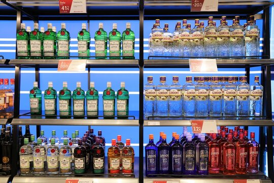 FUERTEVENTURA, SPAIN - DECEMBER 9, 2024: Tanqueray, Gordon's and Larios gin bottle prices in a duty free shop in Fuerteventura Airport, Spain.