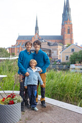 Family with children and pet dog, visiting nortern cities in Sweden, Uppsala
