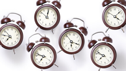 Random pattern of alarm clocks on a white background