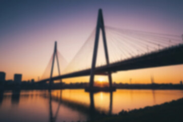 Obraz premium blurry photo of bridge in the afternoon showing beautiful sunset radiating from the corner of the bridge