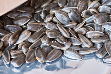 Sunflower seeds in a package. Selective focus