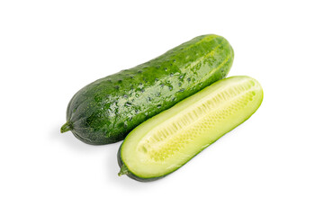 One whole and one halved slice of fresh juicy healthy green cucumber crop wet with water drops isolated on white background used as ingredient for vegetarian detox vitamin salads and refreshing drinks