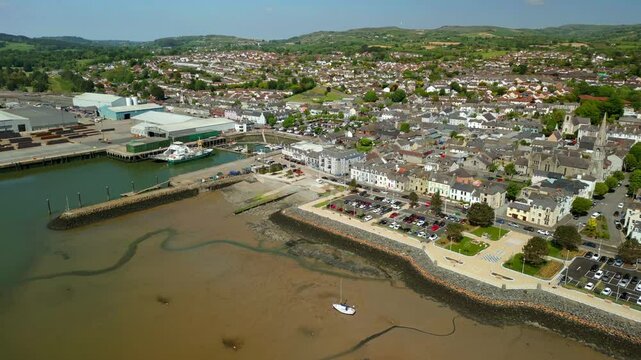 Overhead rising aerial video of Warrenpoint, County Down, Northern Ireland, UK on a bright and sunny day. Filmed in 4K, 60FPS and with Rec709 color.