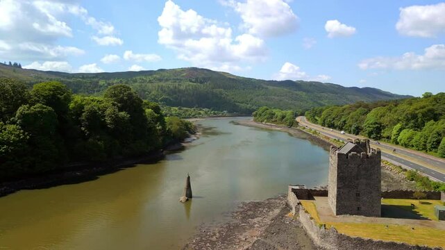 Advancing and descending aerial video of Narrow Water Keep in Warrenpoint, County Down, Northern Ireland, UK on a bright and sunny day. Filmed in 4K, 60FPS and with Rec709 color.