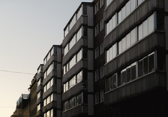Low angle view of buildings in city during evening