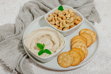 Homemade vegan cashew cheese. Raw healthy sauce in a bowl, lactose free food. Bio organic product
