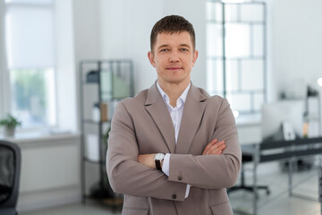 Portrait of handsome middle aged man in office