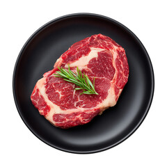 raw ribeye steak on black plate top view isolated white