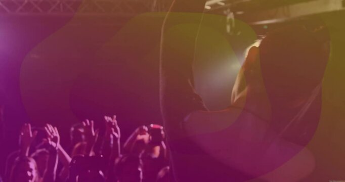 Female singer singing, raising arms to cue crowd on music stage, with animated sound waves pulsing