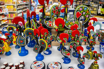 Traditional ceramic sculptures from Portugal, named Cork of Barcelos in souvenir store of Funchal,...