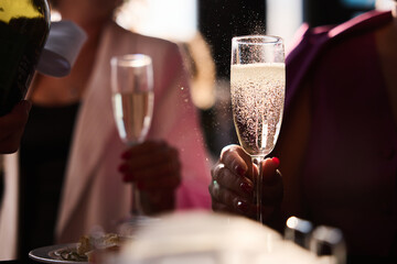 Close-up of woman holding wine glass