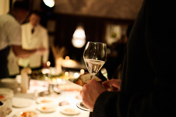 Elegant man holding wine glass