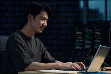 Hacking and malware concept. Hacker using abstract laptop with binary code digital interface.
