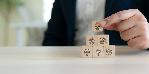 Creative idea generation for new product development concept. Creative thinking and innovation. Wooden block with stages of innovation icons, generating creative idea process for product developmement