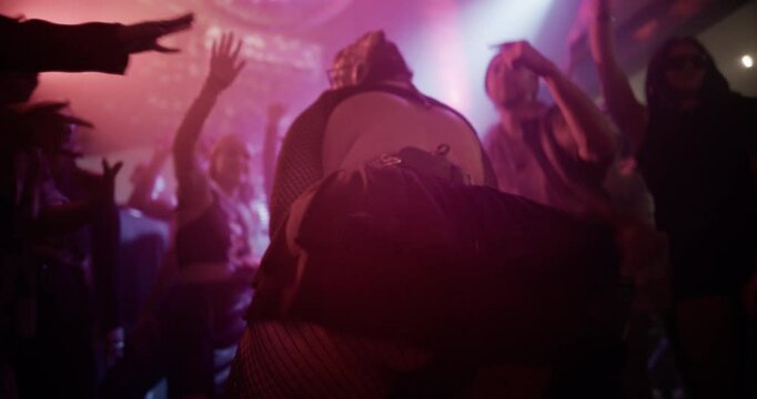 Confident Plus-Size Woman Twerking on a Dancefloor Under Flashing Club Lights. Curvy Female Dancer Moves to Electronic Music. Footage Celebrates Body Positivity, Confidence, Empowerment, Inclusivity