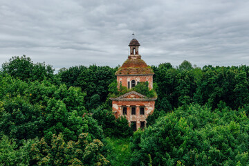 Old overgrown ruined abandoned church, aerial view. Church of the Icon of the Mother of God The...