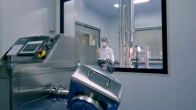 Biotechnology laboratory with scientist or researcher scientists in lab coats performing a biological experiment, advanced equipment for Analysis