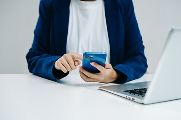 Businesswoman hand working digital marketing media in virtual screen with mobile phone and modern compute