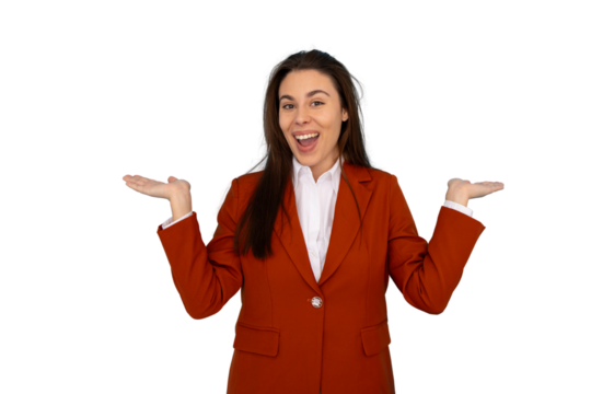 Excited businesswoman wearing an orange suit and white shirt showing something with open hands, smiling and presenting on transparent background - Powered by Adobe