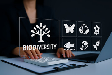 Researcher records biodiversity levels. Hands catalog various species across ecosystems, showing...