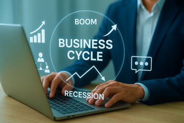 Hands analyze business cycle stages on a graph—boom, slowdown, recession, recovery. Floating UI visualizes trends and forecasts for decision-making.