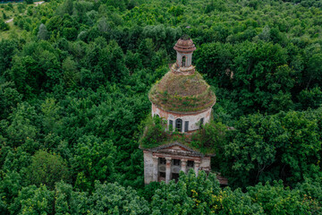 Old overgrown ruined abandoned church, aerial view. Church of the Icon of the Mother of God The...