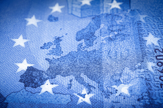 Shallow focus on Europe map from an Euro banknote in blue tone.
