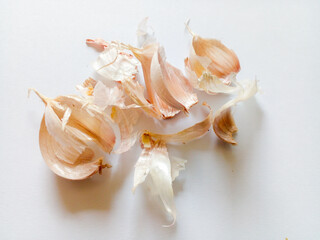 Peeled garlic skin isolated on white background.