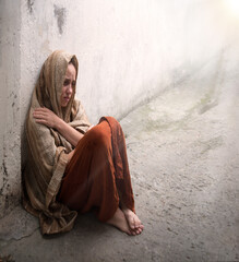Frozen girl sitting on the floor