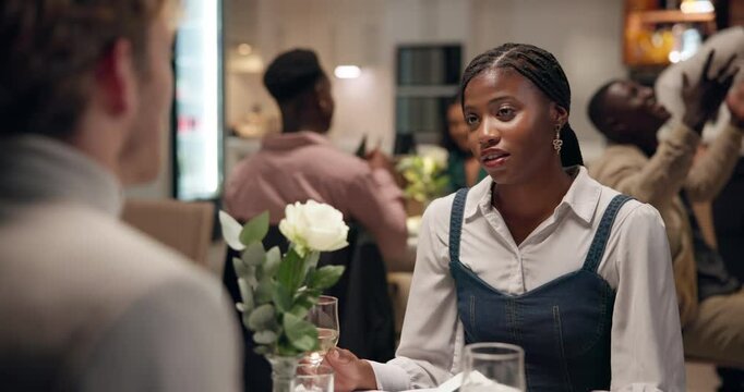 Restaurant, couple and conversation with conflict on date, discussion together and wine for dinner. Fine dining, partner and woman with sorry for disagreement, anniversary mistake and alcohol drink