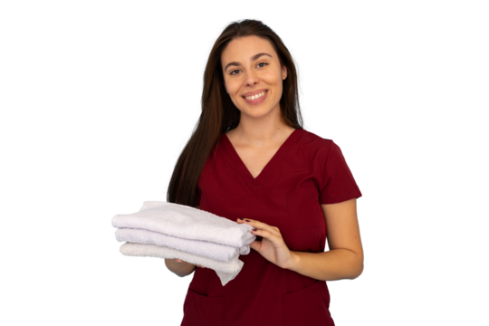 Masseuse smiling and holding clean white towels, ready to begin a massage therapy session, on transparent background
