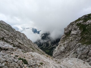 Panoramic view of Logarska dolina valley with peaks of Slovenian Alps covered by passing clouds. © Semi