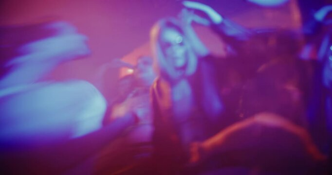 Abstract Nightclub Footage with Party People Dancing, Stroboscopes Flashing, Lights Swirling, Different Silhouettes, Patterns. Moody, Immersive Visual of Nightlife Energy, Music and Rhythm