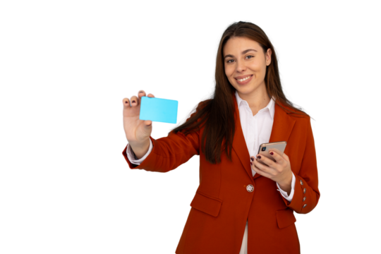 Businesswoman smiling and showing credit card while holding smartphone, promoting online shopping and secure payment methods