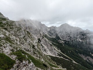 Panoramic view of Logarska dolina valley with peaks of Slovenian Alps covered by passing clouds. © Semi