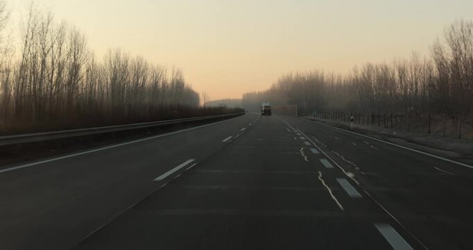 Highway driving view at dawn