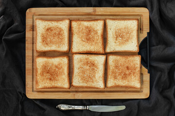 Flat lay of toasted white bread topped with labneh, fresh raspberries, blueberries, maple syrup, and flax seeds. Sweet breakfast or brunch idea with natural light and food styling
