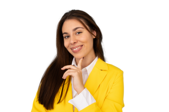 Professional businesswoman wearing bright yellow jacket, resting hand on chin with contemplative look, standing against neutral background
