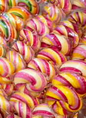 Color lollipop, spiral candy on stick, colorful striped lollypop, round fruit caramel, multicolored confectionery