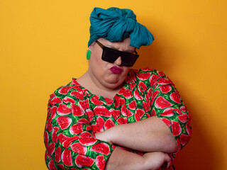 Cool plus size woman crossing arms with sunglasses