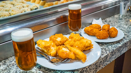 Battered Cod Typical Spanish Tapa and Beers at Restaurant Bar, Spain, Europe