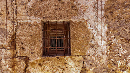 Closed Old Traditional Window on an Old Wall