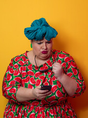 Surprised plus-size woman looking at smartphone with wide expression