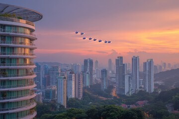 An airplane flying above an urban skyline silhouette at sunset, with buildings and cityscape visible in the background.