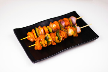 Raw Grill chicken on plate, Raw chicken shashlik with vegetable on plate in white background